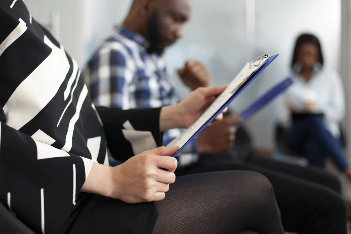 Woman Holding Clipboard Office Lobby